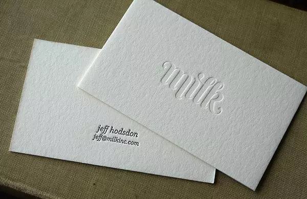 White card with debossed text